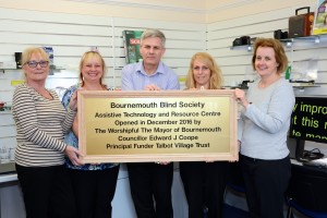 Blind and partially-sighted people can learn how to use laptops and mobile phones in a new Assistive Technology suite created thanks to a £38,000 charitable donation. L-R Geraldine Bradley, Sara Olden,Phillip Tarrant,Jo Wood and Caroline Simons hold the plaque which marks the opening of the new Assistive Technology suite.