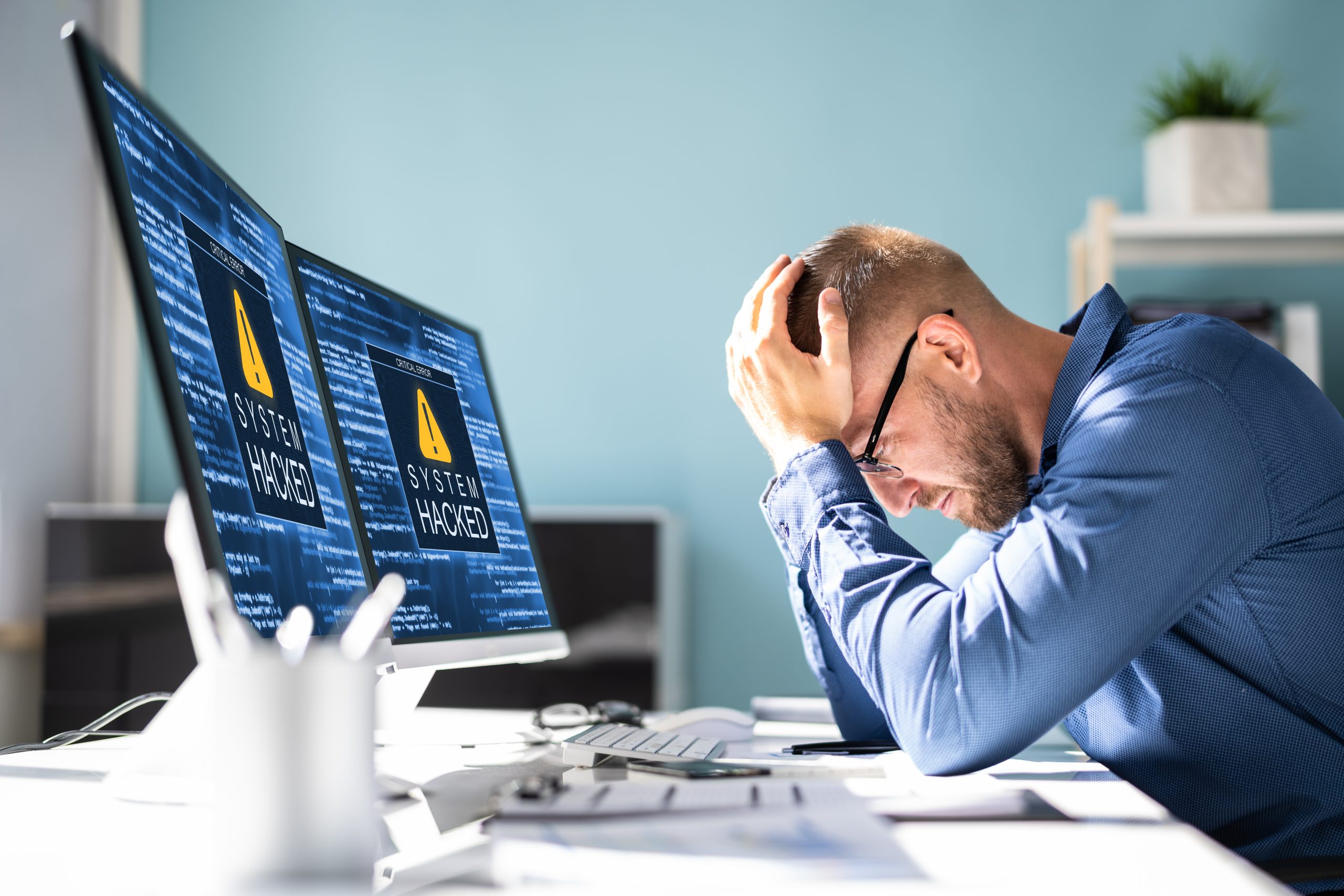 image of a man experiencing a cyber attack
